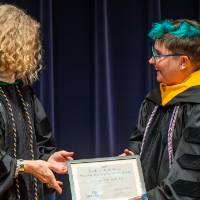 Provost Drake giving Jay Knight an award